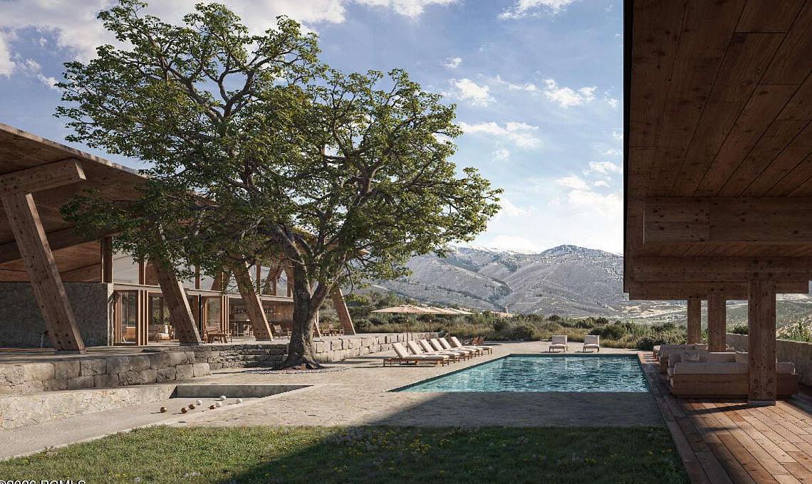 Heated pool with loungers and mountain views at Wildwood Reserve, home of The Skyfall Residence near Deer Valley
