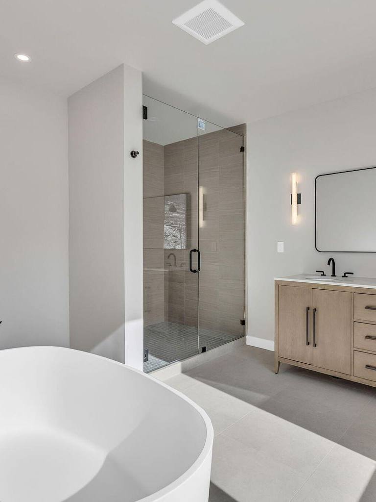 Primary bath with soaking tub and double vanity at The Skyfall Residence, Park City vacation home